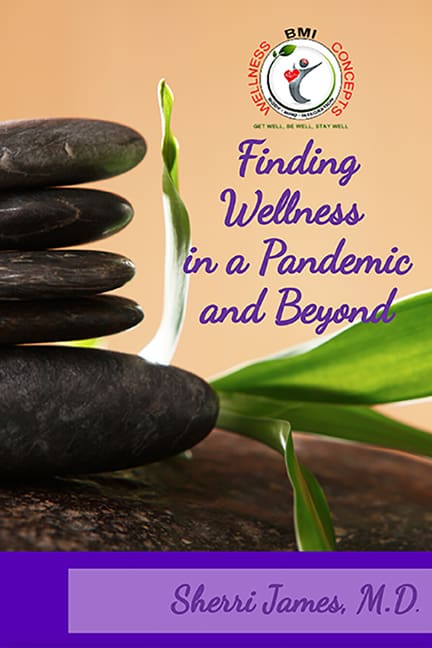 Stacked stones with green leaves and text.