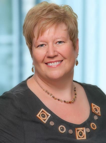 Smiling person in a professional setting.